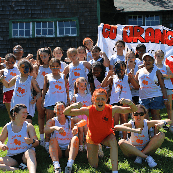Rustic camp setting with campers connecting in nature